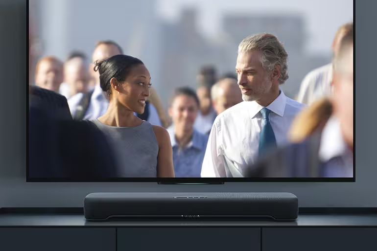 B200A below a TV displaying a movie scene