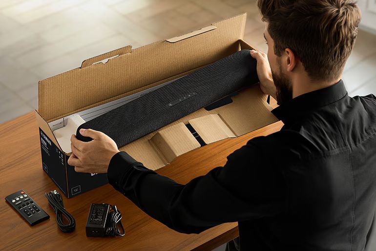 Person taking a B200A out of its packaging