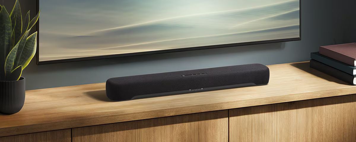 B200A on a wooden shelf beneath a TV