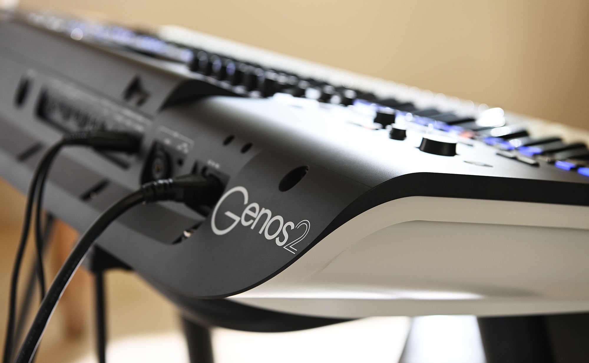 Close-up of the Genos2 logo on the back of the instrument